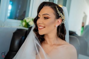 Romantic bridal portrait series capturing genuine smiles and elegant wedding day styling.