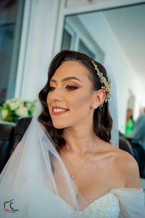 Beautiful bridal portraits showcasing detailed lace dress, sparkling accessories and natural makeup.