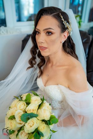 Artistic bridal portraits showcasing a beautiful bouquet of pale yellow roses and crystal hair accessories.