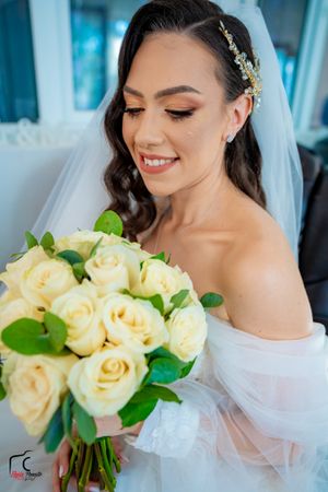 Romantic bridal photography sequence with cream roses and off-shoulder wedding gown details.