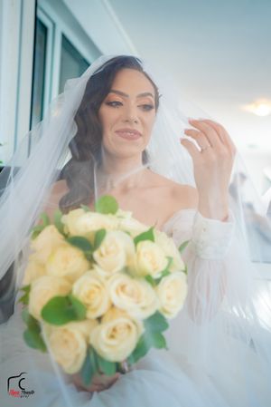 Soft focus wedding photography sequence showing cream roses and flowing veil details.