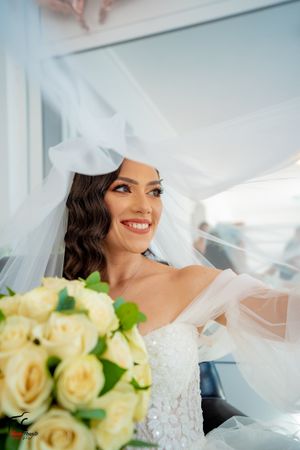 Elegant bridal series showing details of lace dress, veil, and yellow rose bouquet.