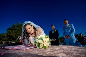 Wedding ceremony documentation moment from ground level perspective.