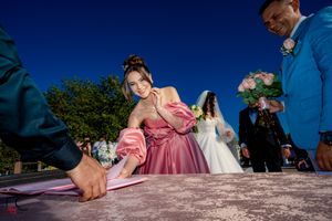 Wedding ceremony document signing captured from creative low angle.