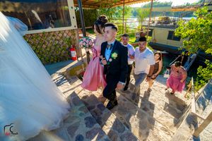 Garden wedding venue with natural stone pathway and verdant landscaping in afternoon light.
