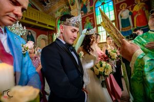 Wedding ceremony in a beautifully decorated venue with pink and green color accents.