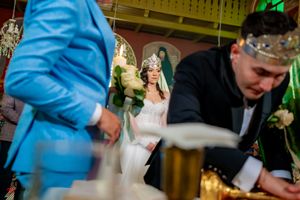 Wedding reception detail shot showing decorative elements in an ornate ballroom setting.
