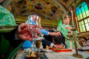 Artistic view of wedding reception details with baroque architecture and green lighting.
