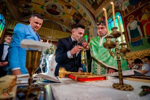 Wedding celebration details in historic venue with baroque architectural elements.