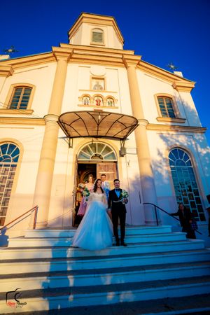 Sunset wedding photography session on grand church steps with classical architecture.