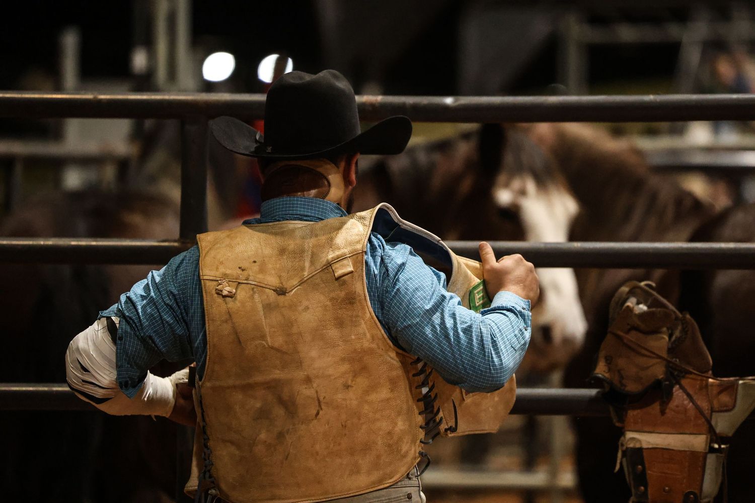 Behind the chutes getting ready for his retirement ride. Bronc Rider