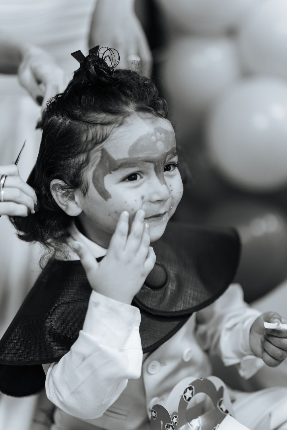 A series of black and white photos showing someone wearing a protective face mask during a health crisis.