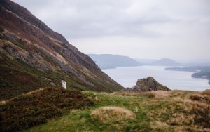 Elopement photography in the Lake District wide lake shot with bride and groom