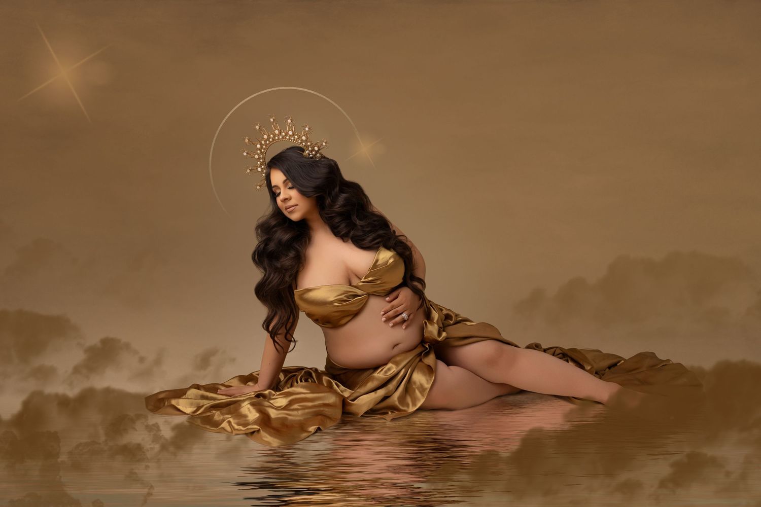 Artistic maternity photo with gold dress in ethereal water setting.