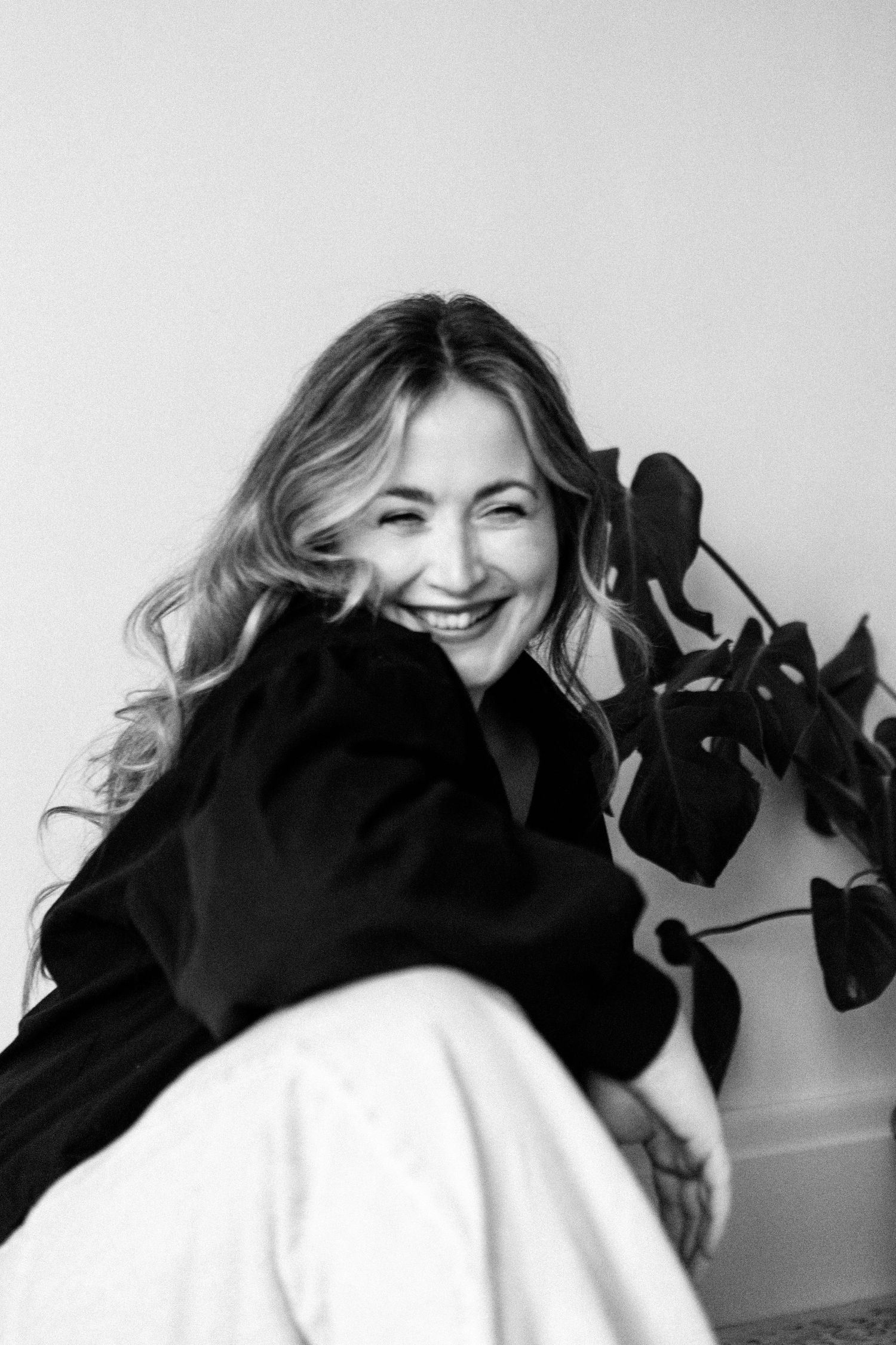 Studio portraits showing different poses in soft lighting against a neutral background.