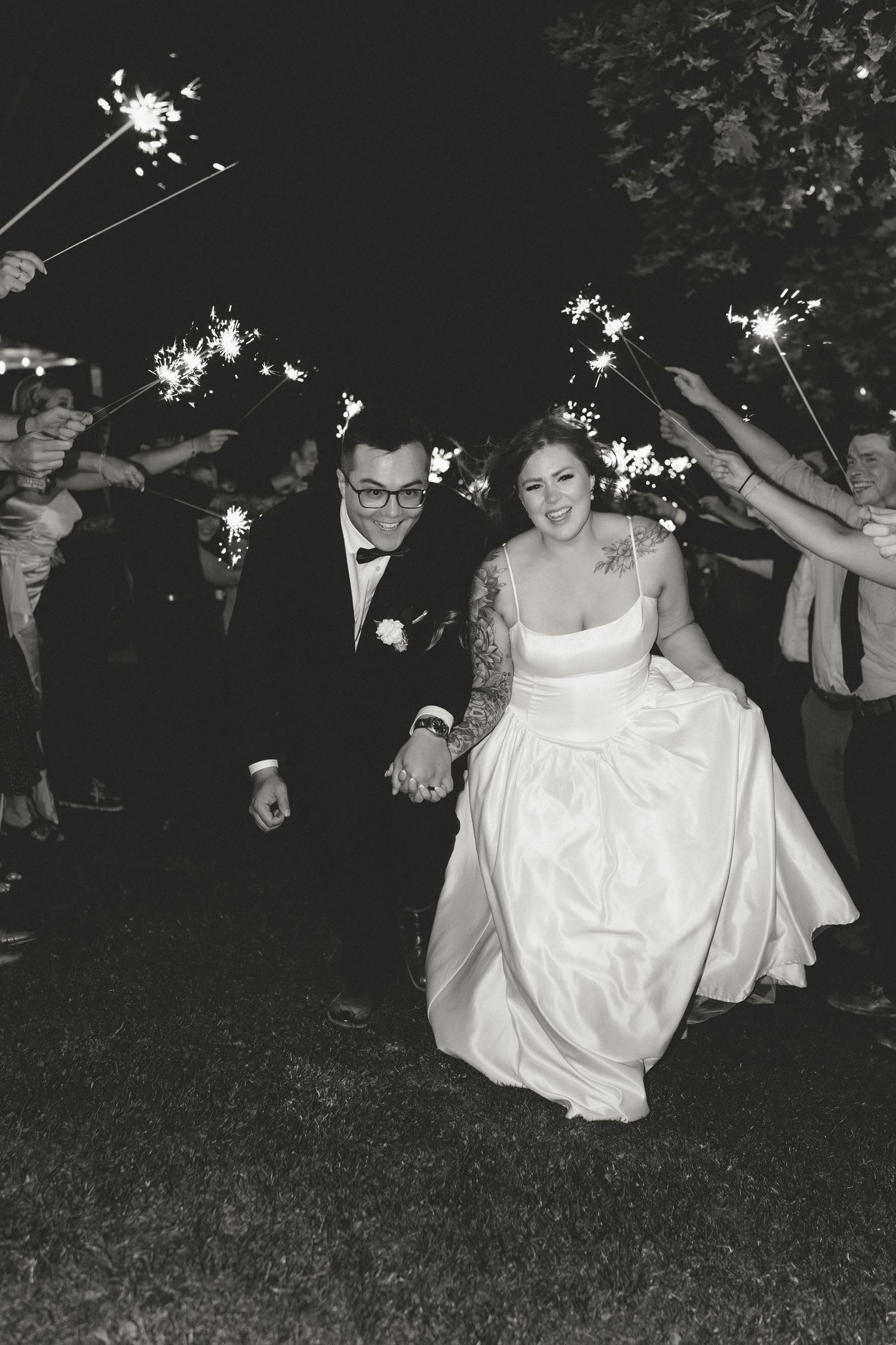 a bride and groom during their sparkler exit, after their fun okanagan, vineyard elopement