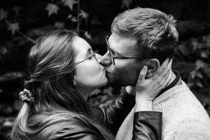 Black and white romantic portrait series with natural outdoor elements.
