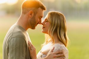 Intimate couple portrait at sunset in golden light.
