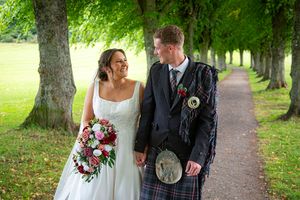 bride and groom at the gardens after they are married