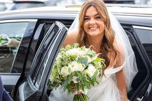 bride getting out of the wedding car