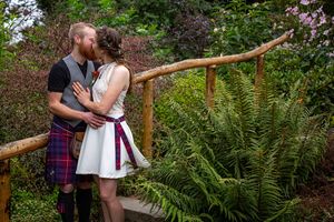 bride and groom at the gardens after they are married