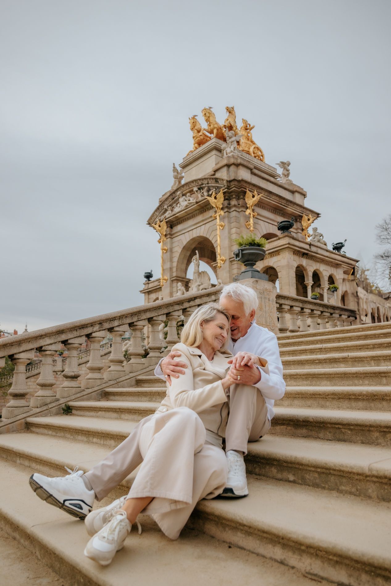 Couple laughing during anniversary photo in Spain. Capturing their deep, effortless connection.