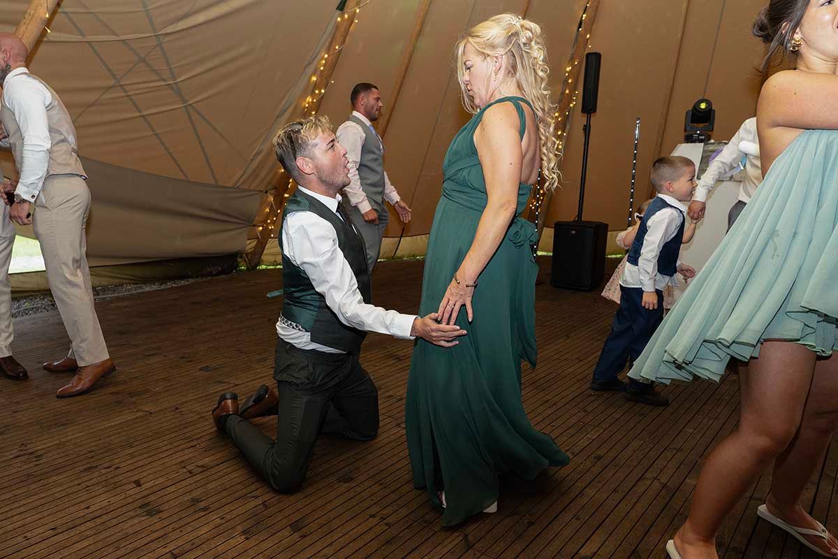 bridesmaid and groomsman dance the night away at a tipi wedding at the den at four acre near wigton cumbria