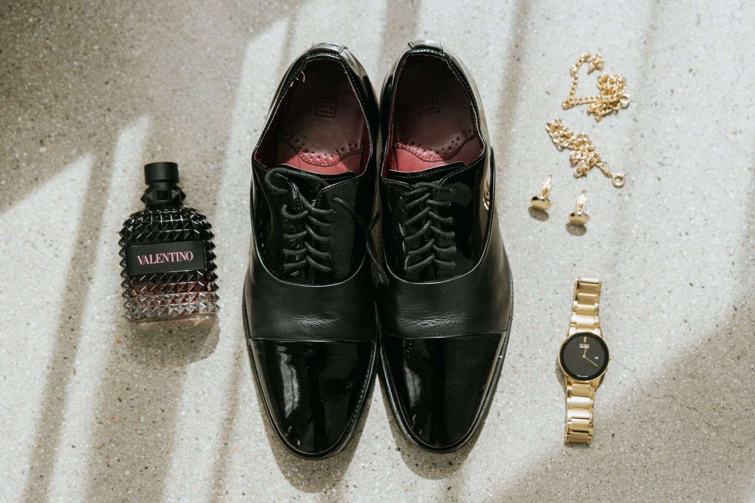 wedding-002
Groom's dress shoes, watch, cologne, and cufflinks arranged for wedding detail photographs.
