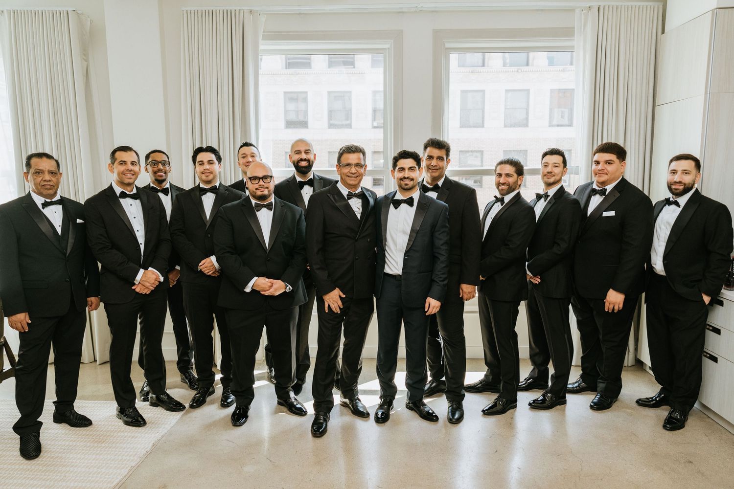 Groom posing with his groomsmen before the wedding ceremony.