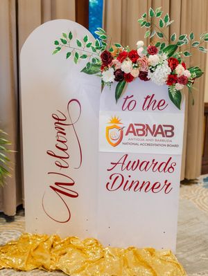 Welcome sign for ABNAB Antigua and Barbuda National Accreditation Board Awards Dinner with floral decor.