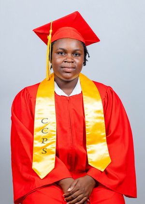Student wearing red graduation cap and gown with gold CCPS honor stole for portrait.