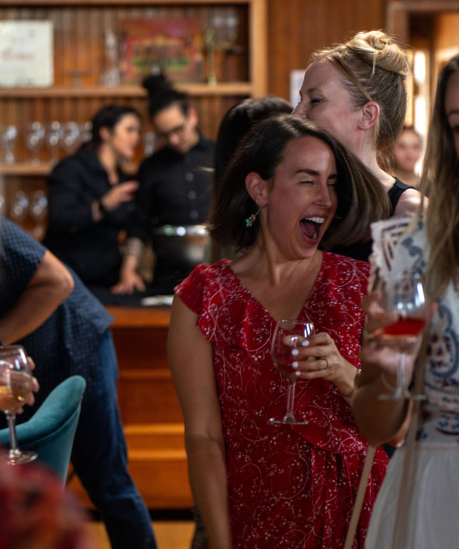 Candid photo from a 40th birthday party celebration, photographed by Ted Warner Photography.