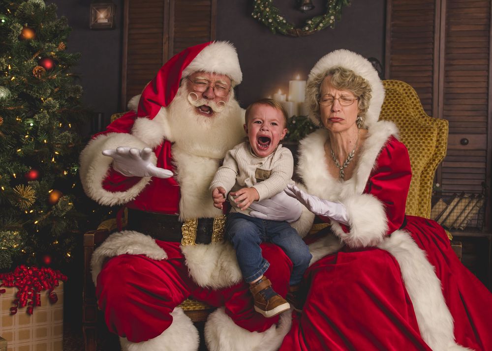 Crying toddler with santa in knoxville