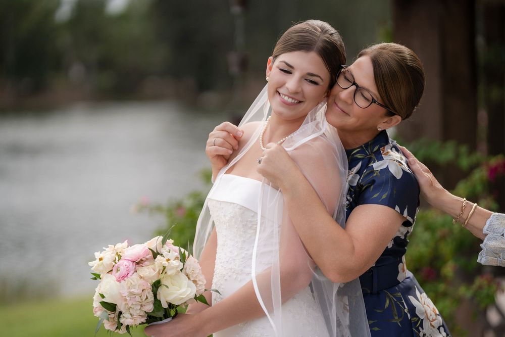 Bride embraced by her mother before the ceremony at White Trail Farm, Hobe Sound, FL