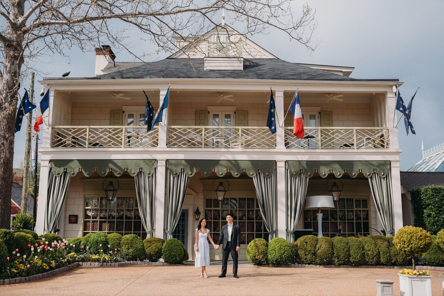 Couple holding hands in front inn at little washington engagement photos