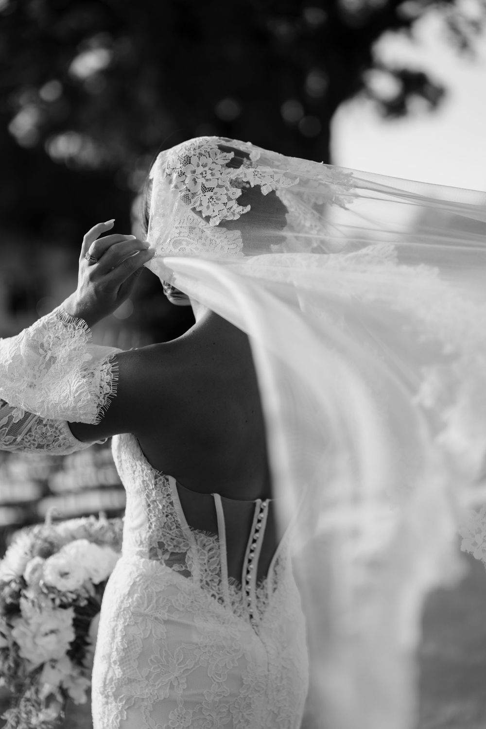 A bride in a white lace dress with flowing veil photographed from multiple artistic angles against a soft blurred background.