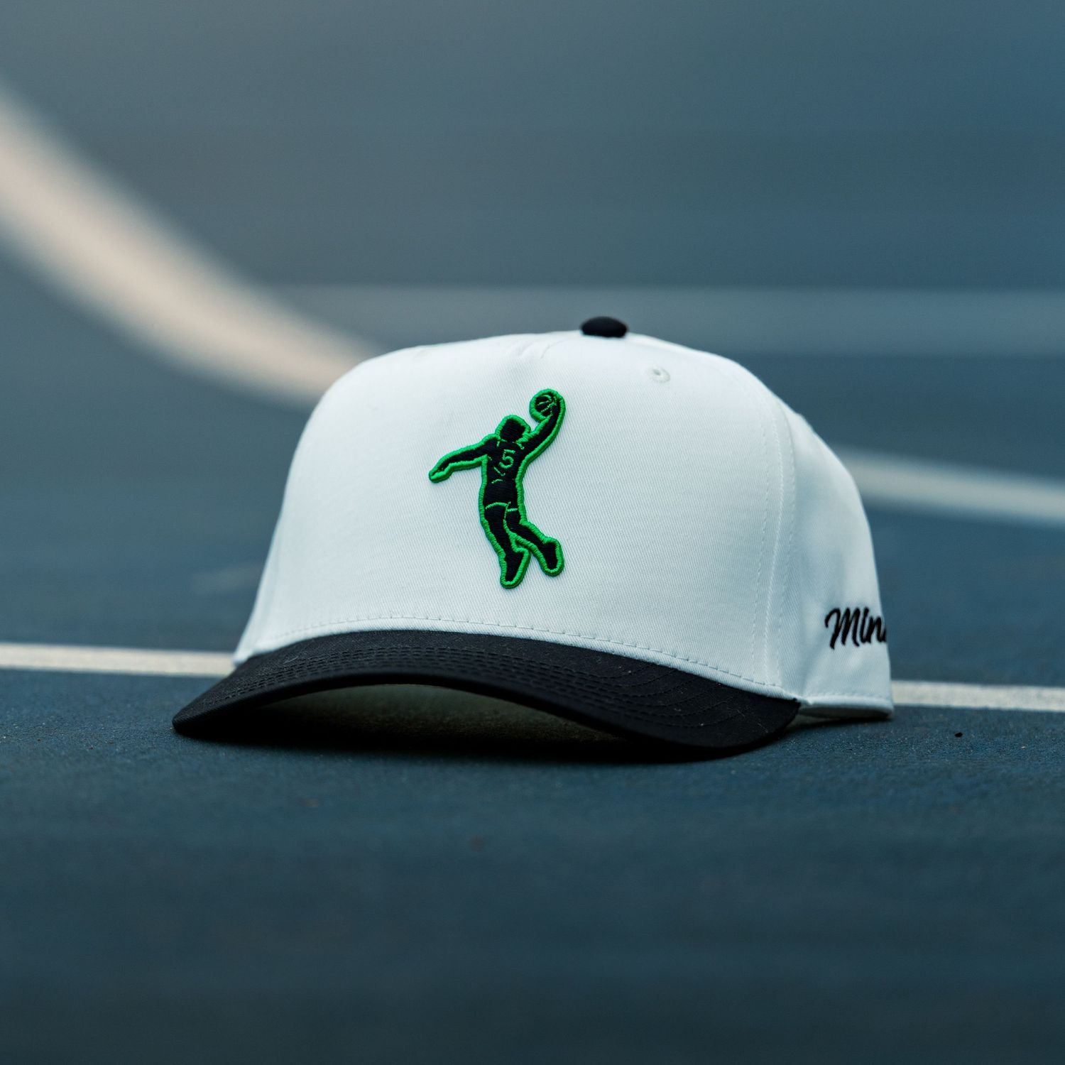 Minny Golf "Ant-Man" hat on the basketball court, Wilcox Park, Grand Rapids MI, 3/14/26