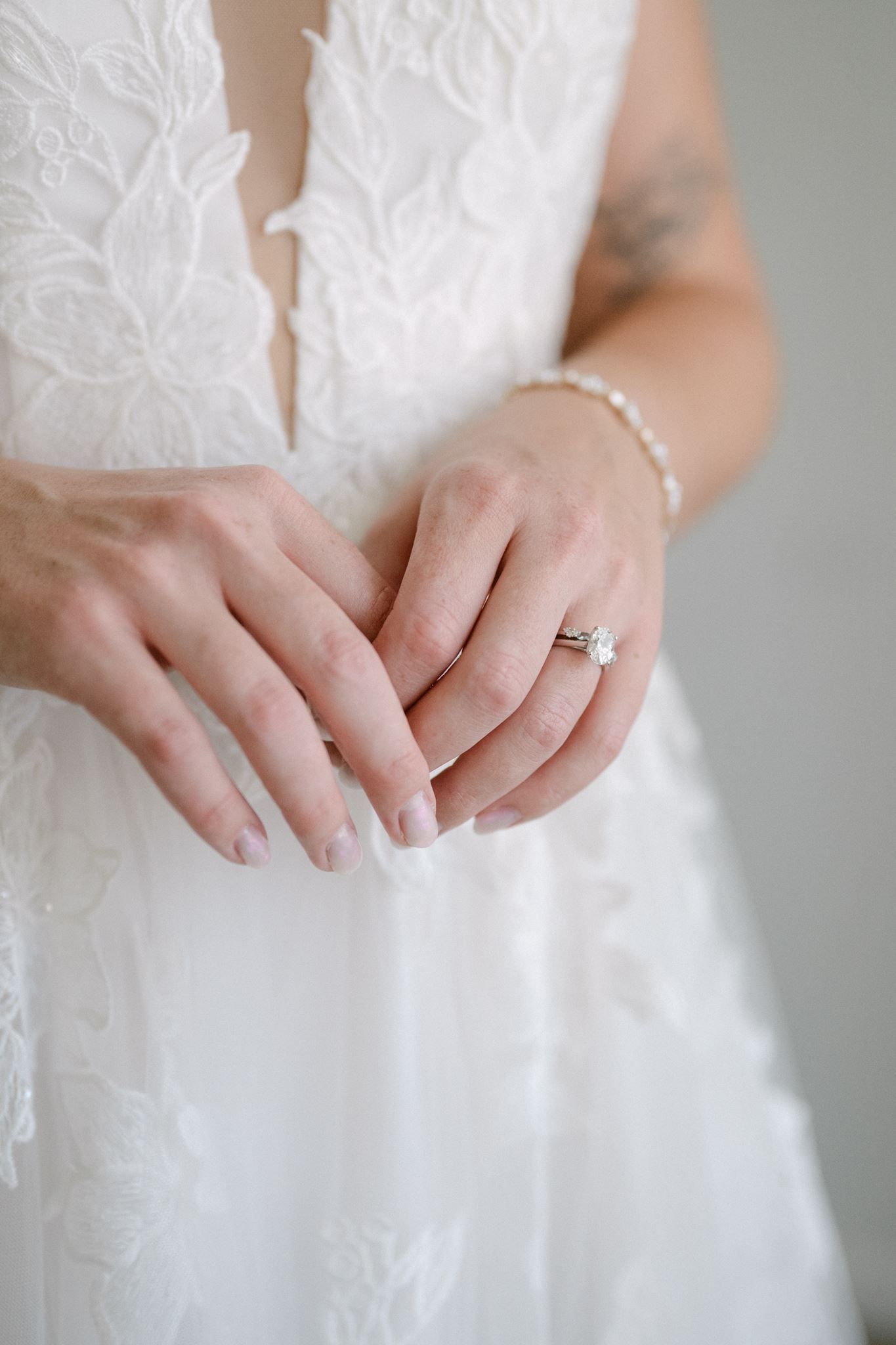 Close up of bride's hands and engagement ring.