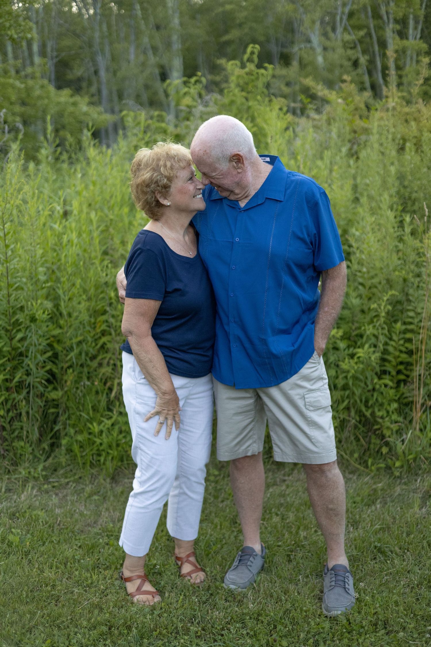 A candid moment of a couple embracing during a photo session