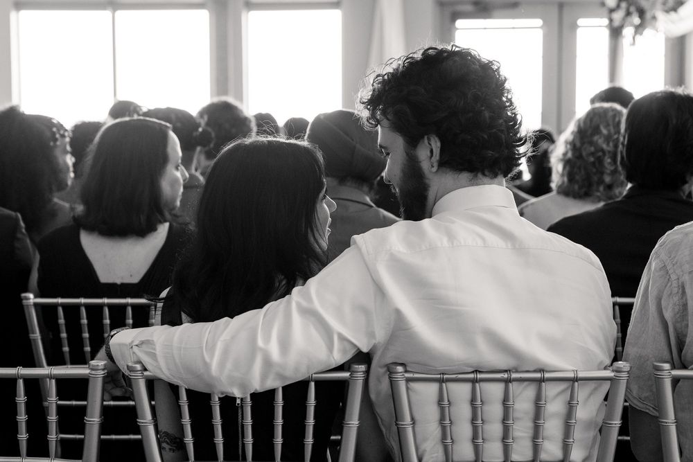 candid moment between a couple at the ceremony
