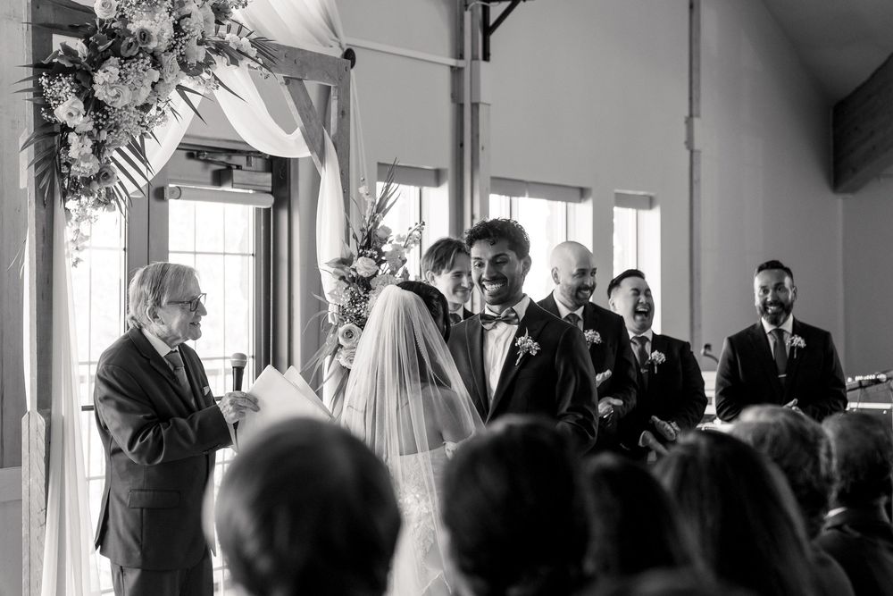 photojournalist and candid of the wedding ceremony at lakeview venue in hamilton