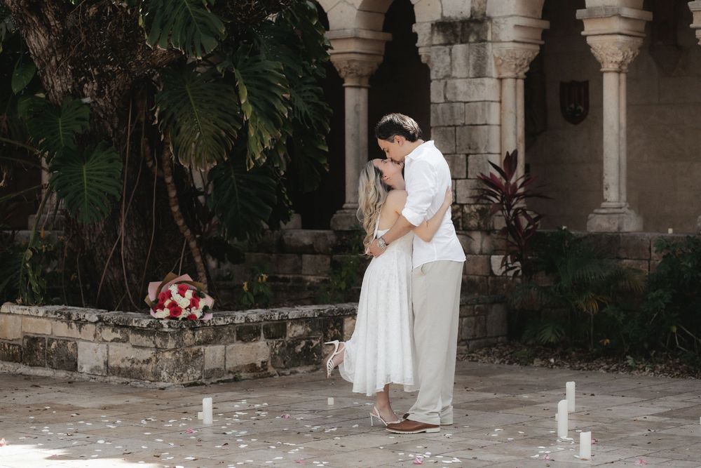Newlywed engaged couple embracing after proposal in The Ancient Spanish Monastery, Miami Beach