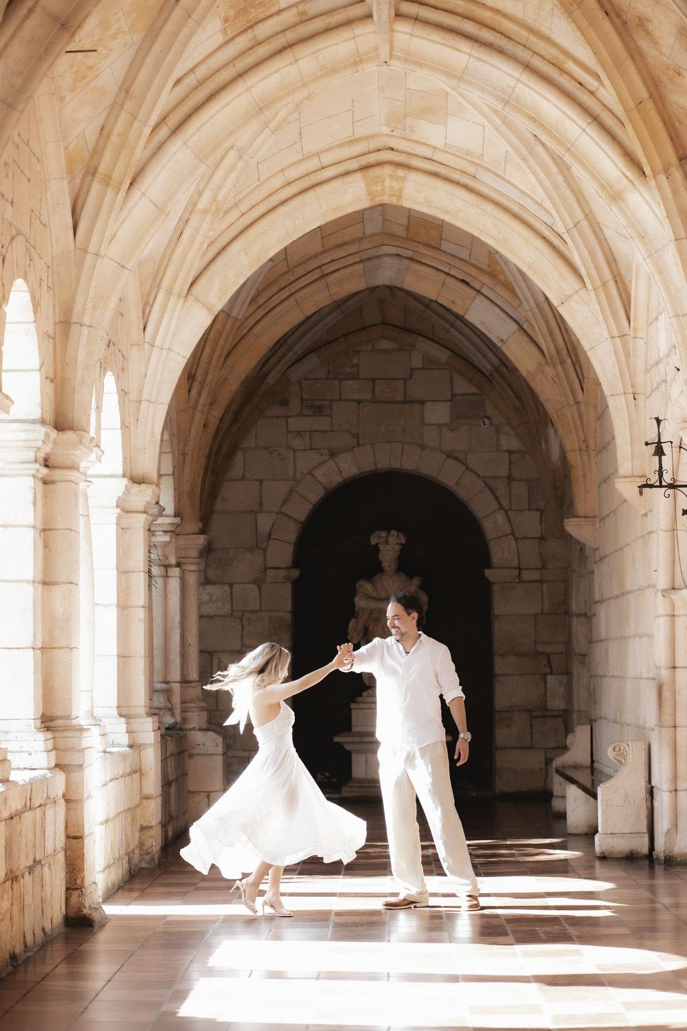 Newlywed engaged couple dancing after proposal in The Ancient Spanish Monastery, Miami Beach