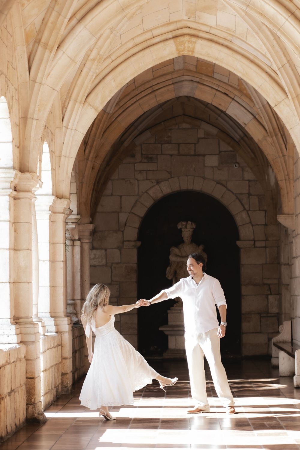 Newlywed engaged couple dancing after proposal in The Ancient Spanish Monastery, Miami Beach