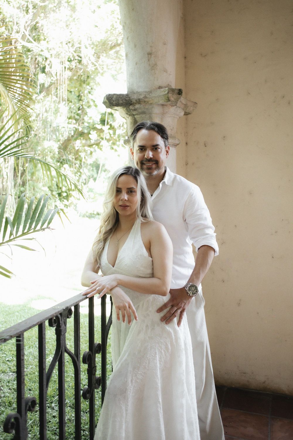 Newlywed engaged couple embracing after proposal in The Ancient Spanish Monastery, Miami Beach