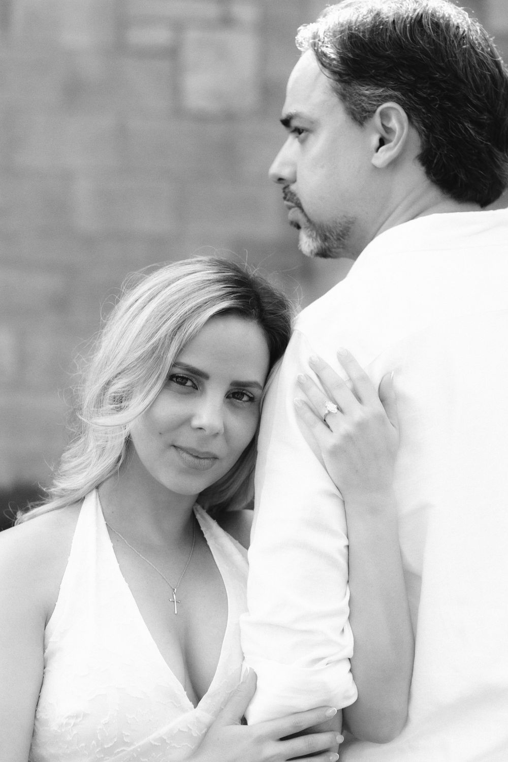 Newlywed engaged couple embracing after proposal in The Ancient Spanish Monastery, Miami Beach