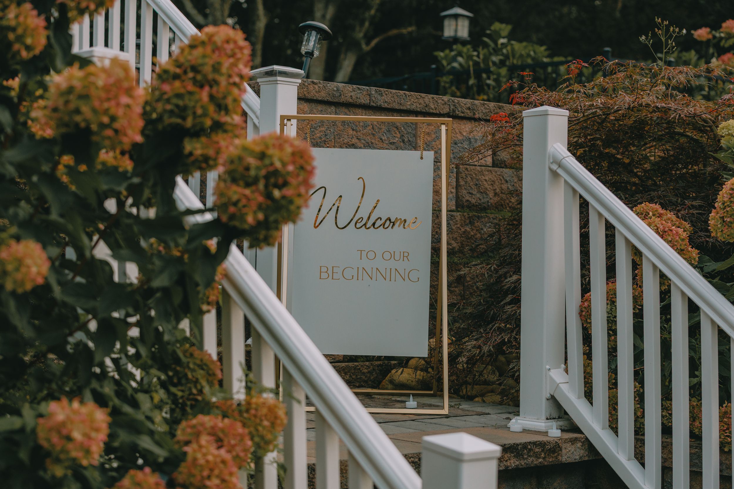 Wedding welcome sign surrounded by flowers at an elegant New York wedding venue