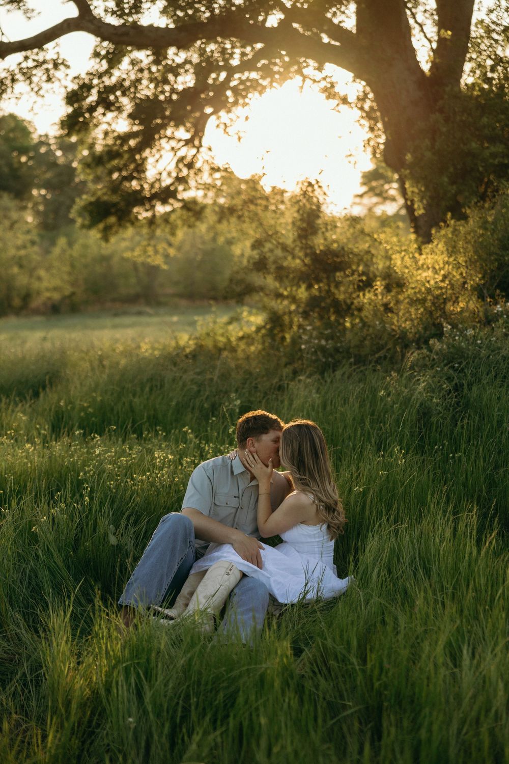 Couple sharing a romantic kiss while having their engagement photos taken near Atlanta.