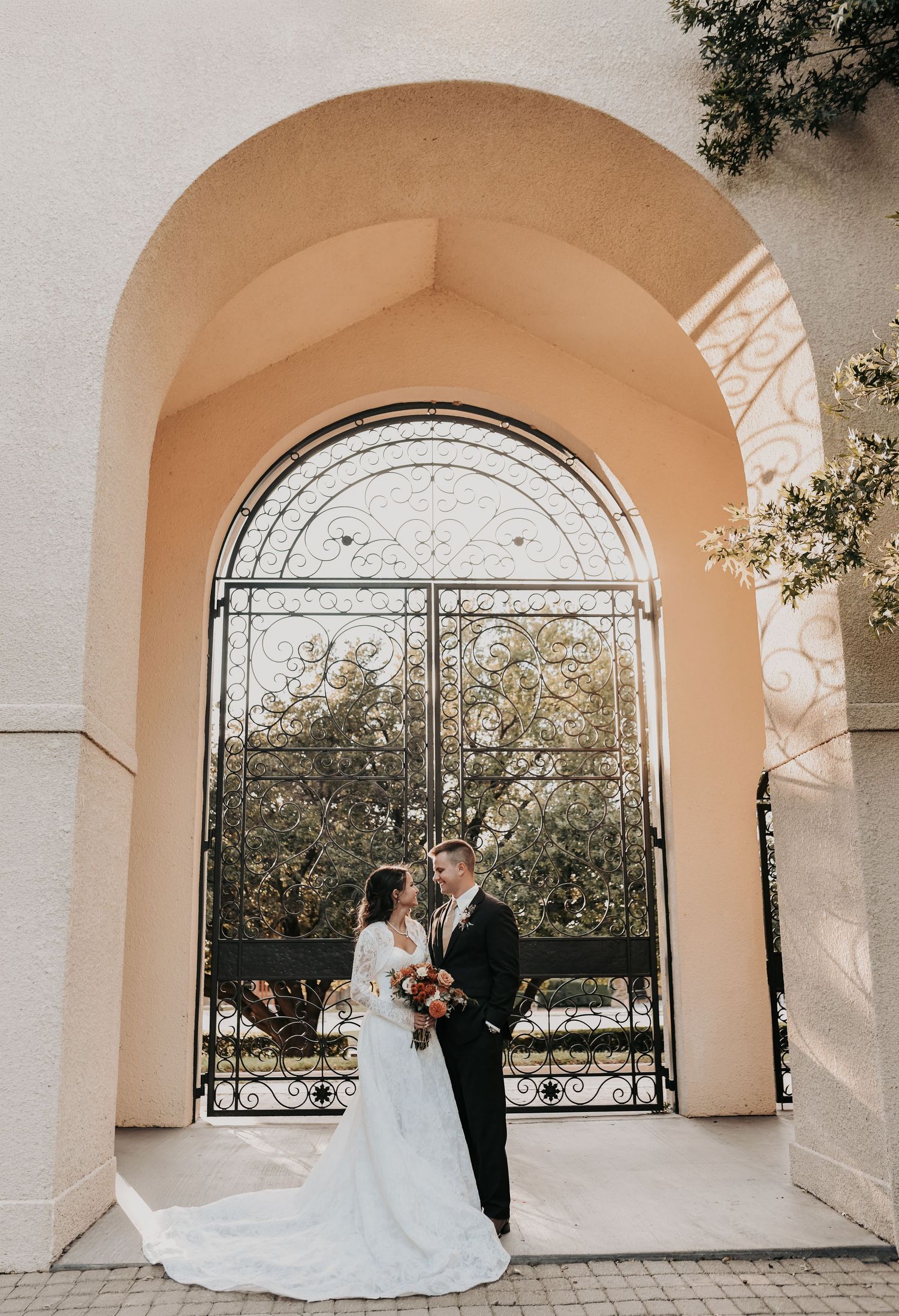 Elegant bride and groom portraits following Catholic wedding ceremony