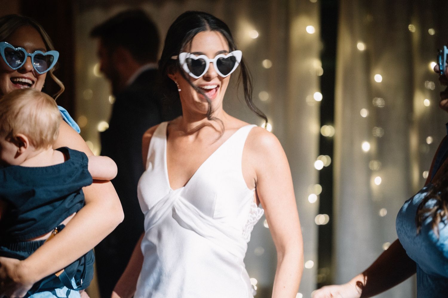 Bride in heart sunglasses on the Post Hotel dance floor, Lake Louise